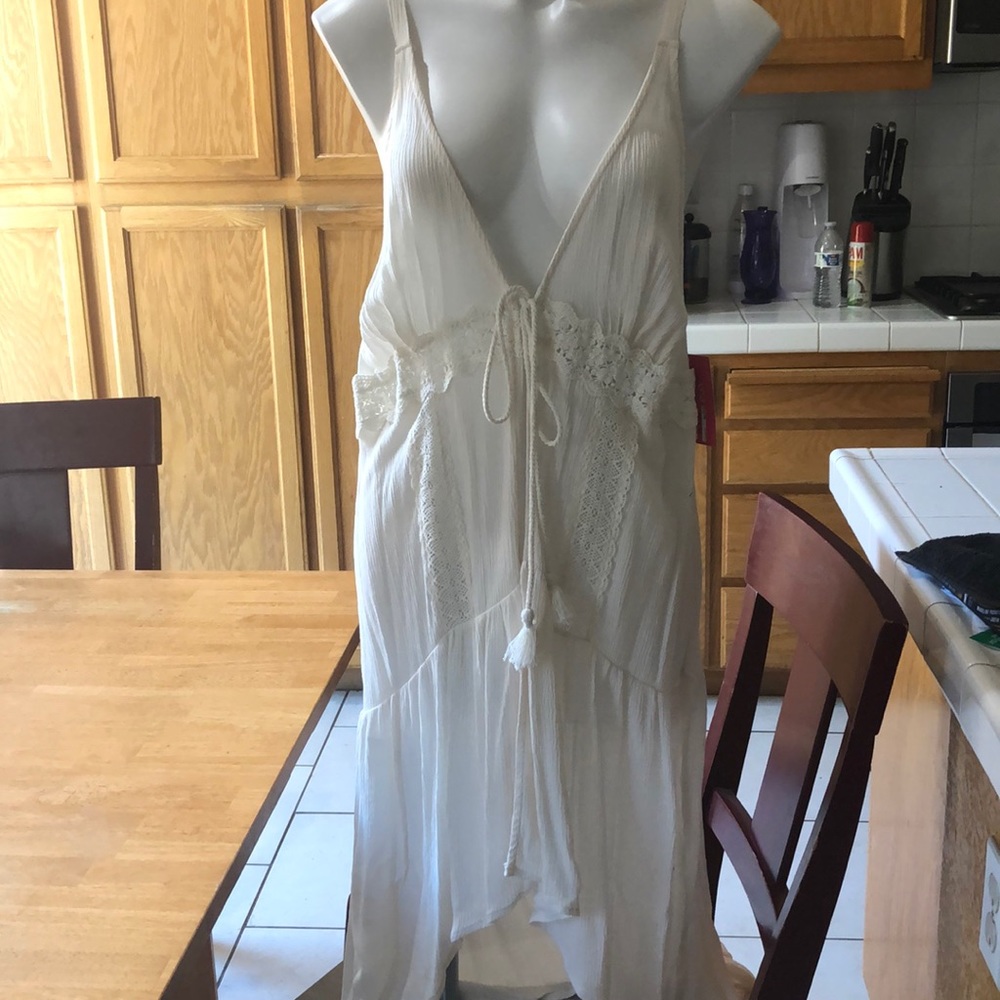 Wrap, cream colored, ties in the front